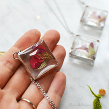 Load image into Gallery viewer, Pendant with tiny rosebud preserved in the class (stained glass technique). Measures approx. 1 x 1&quot; and comes on the 20&quot;  stainless steel cable chain (hypoallergenic and tarnish free).