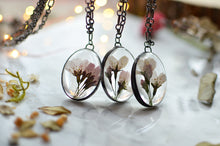 Load image into Gallery viewer, A pendant featuring cherry blossoms preserved in glass (stained glass technique, black patina).