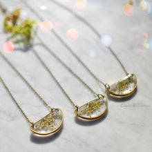 Load image into Gallery viewer, Minimalist yet unique and contemporary design. A pendant featuring locally sourced preserved Queen Anne&#39;s lace in the brass half circle. 