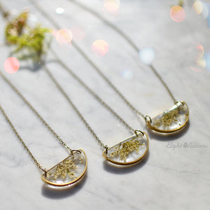 Minimalist yet unique and contemporary design. A pendant featuring locally sourced preserved Queen Anne's lace in the brass half circle. 