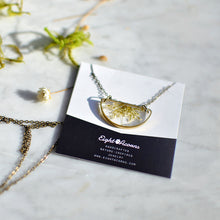 Load image into Gallery viewer, Minimalist yet unique and contemporary design. A pendant featuring locally sourced preserved Queen Anne&#39;s lace in the brass half circle. 