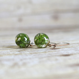 Handcrafted earrings feature a piece of beautiful green Norwegian moss, preserved in the clear jewelry grade resin. 
