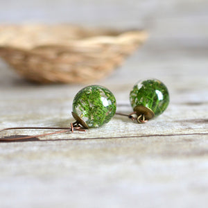Handcrafted earrings feature a piece of beautiful green Norwegian moss, preserved in the clear jewelry grade resin. 